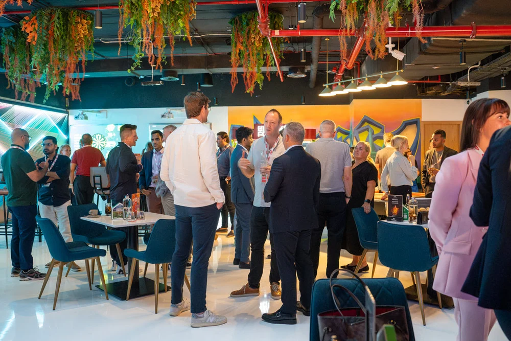 Guests networking in the lounge at Five Iron Golf Dubai